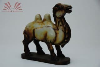 Escultura em pedra representando camelo — Não identificado