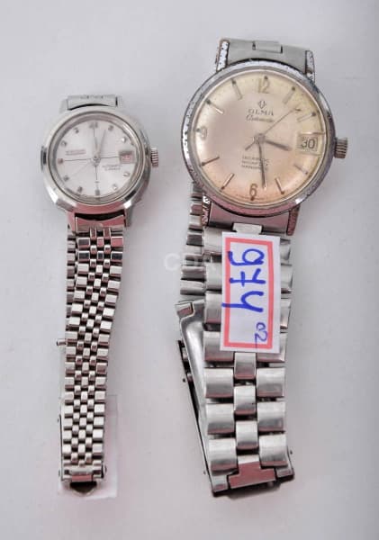 OLMA E SEIKO - Dois relógios de pulso, caixa e pulseira em aço. — Não identificado